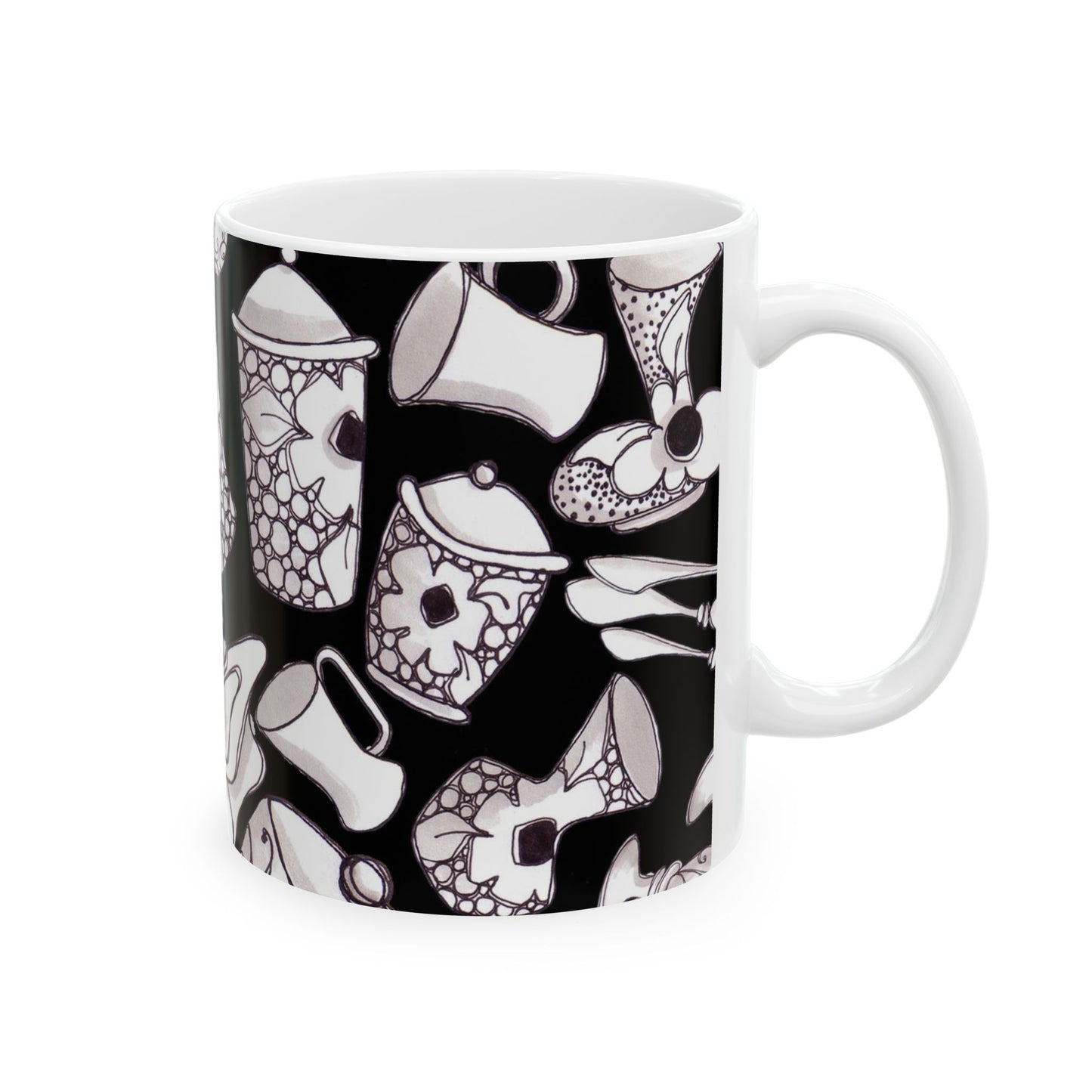 White mug with black background, featuring white floral outlines and abstract patterns.