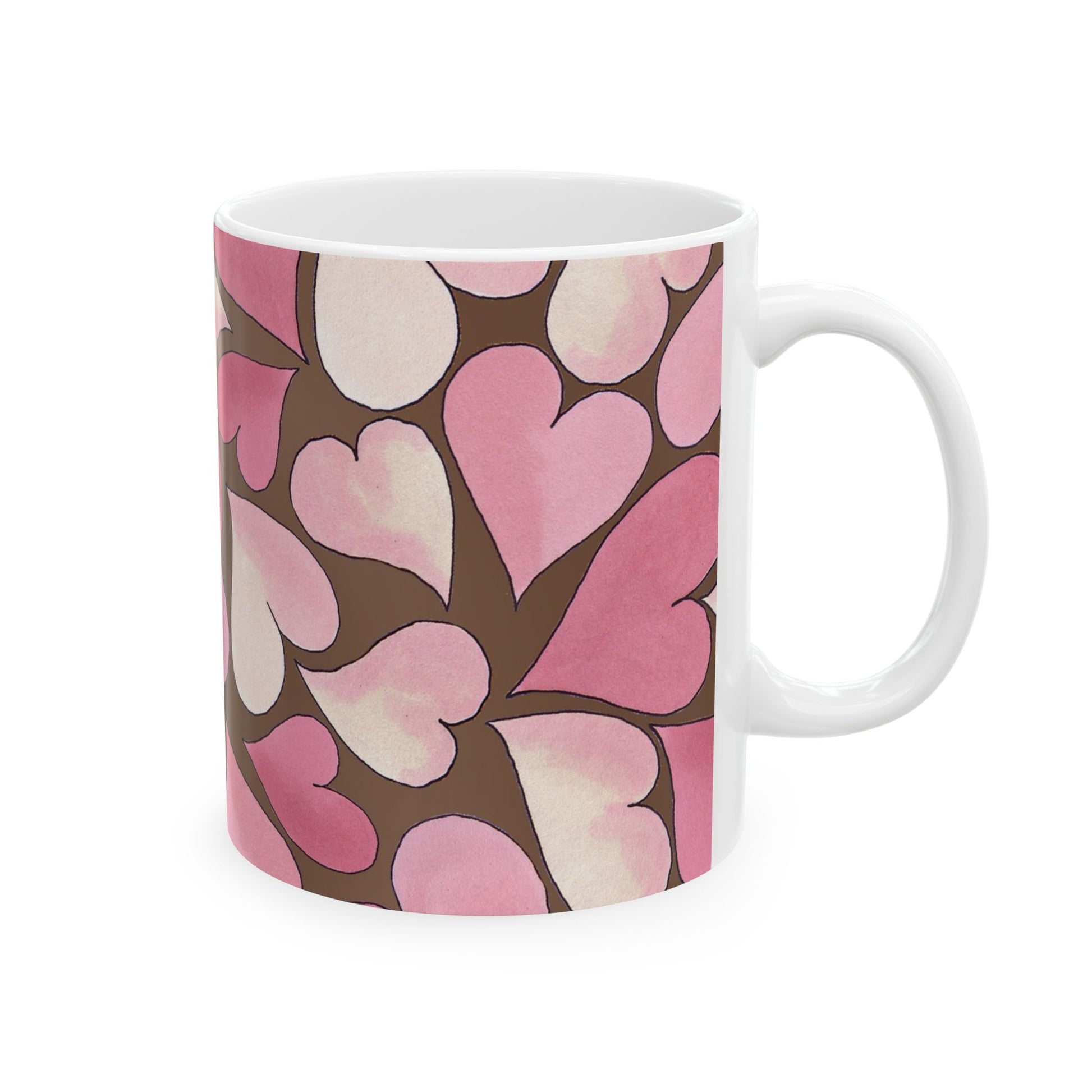 White mug with a pattern of overlapping pink and brown hearts.