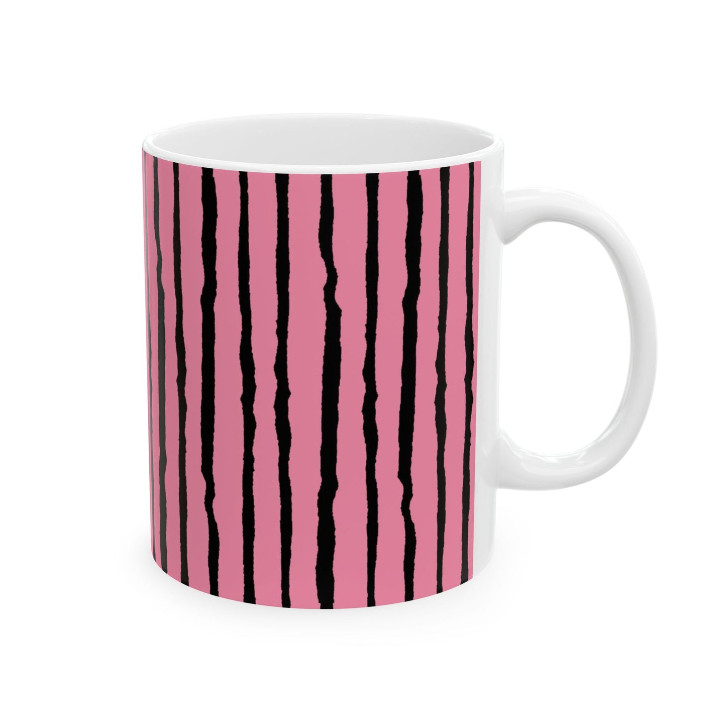 White mug with pink background and irregular black vertical stripes.
