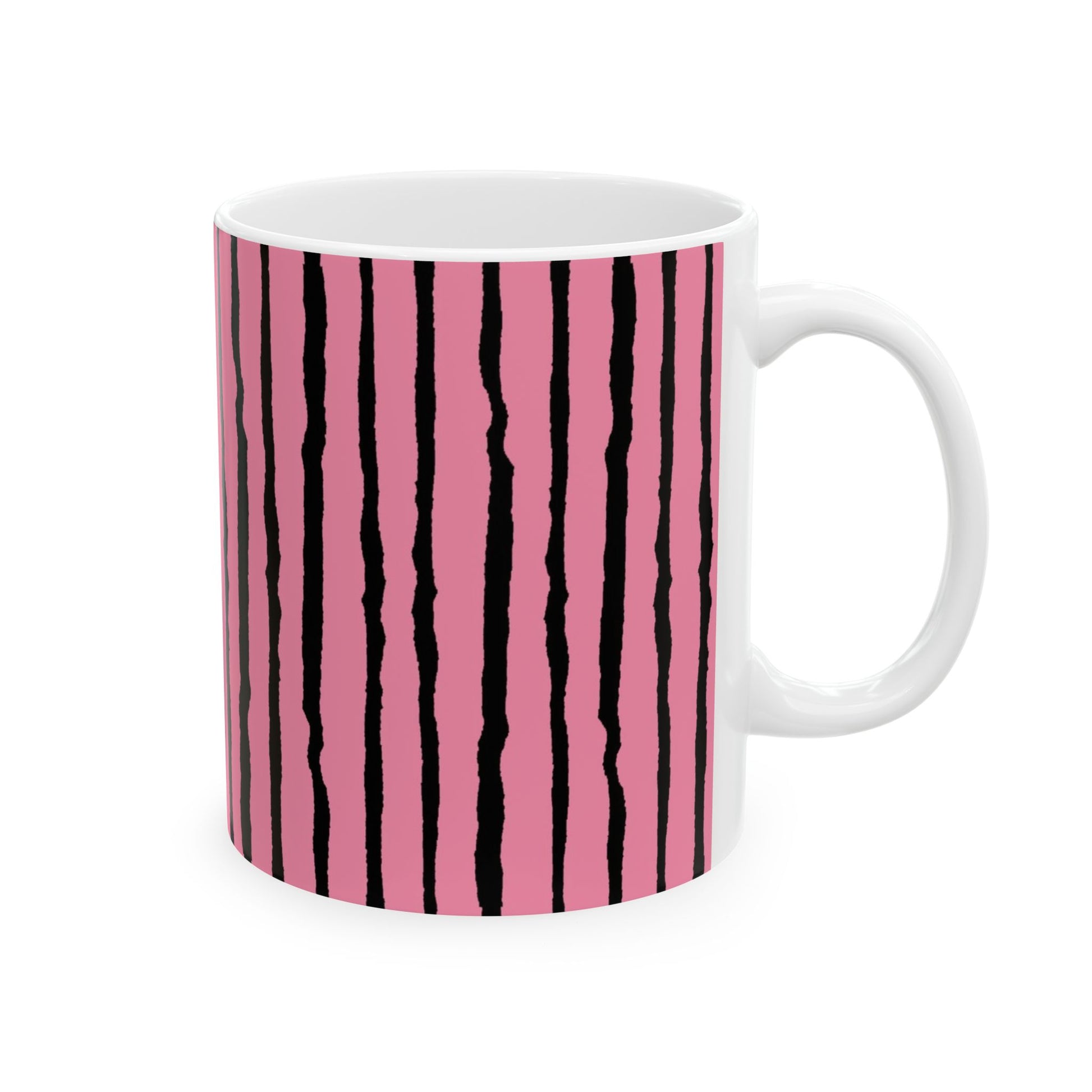 White mug with pink background and irregular black vertical stripes.