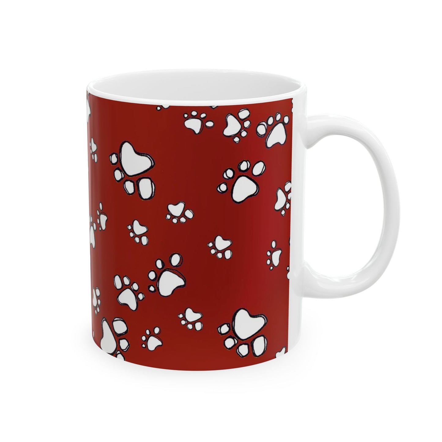 White mug with red background and scattered white paw prints.