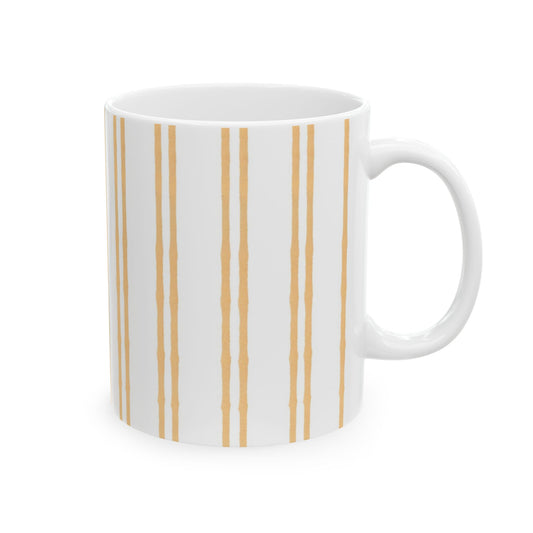 White mug with vertical gold stripes and a glossy finish.