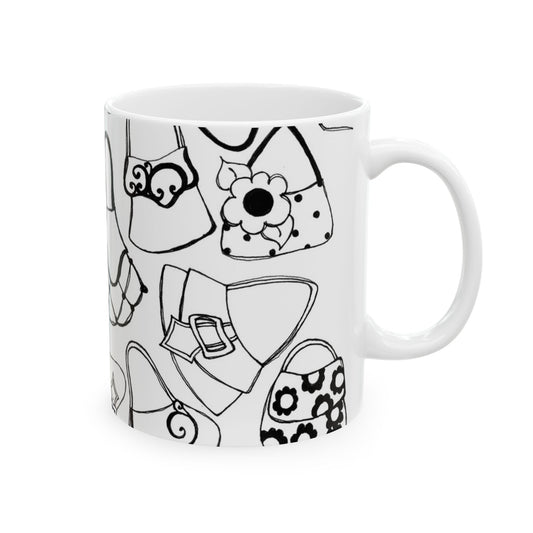White mug with black outlined handbag designs, featuring floral and abstract patterns.