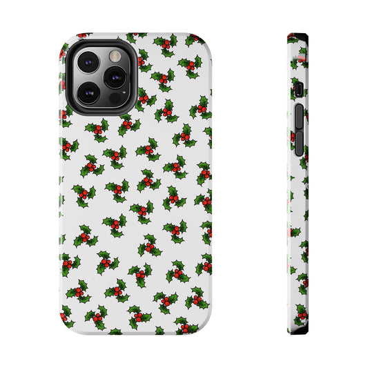 White phone case with green holly leaves and red berries pattern, shown from back and side views.