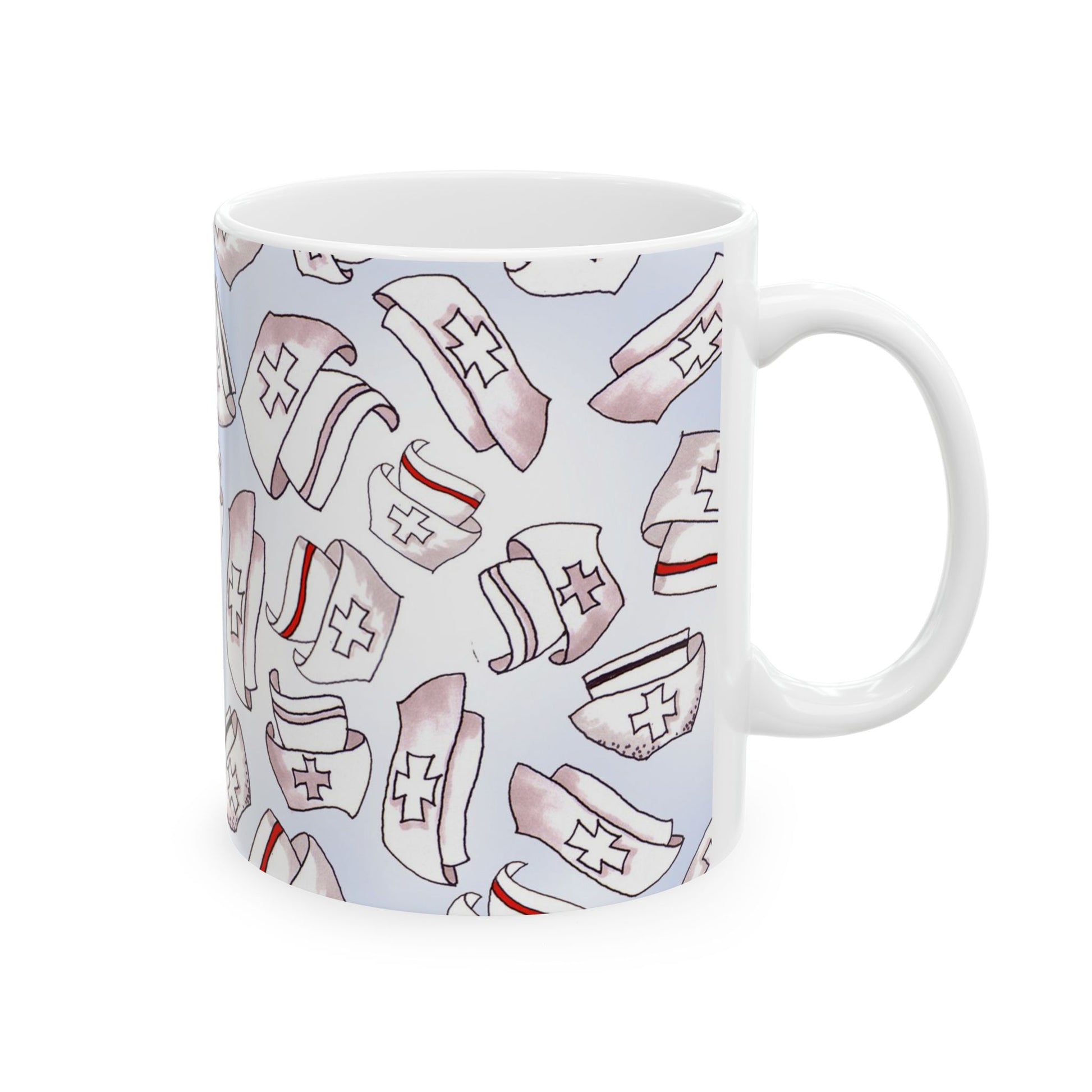 White mug with a pattern of nurse hats featuring red cross symbols and stripes on a light background.