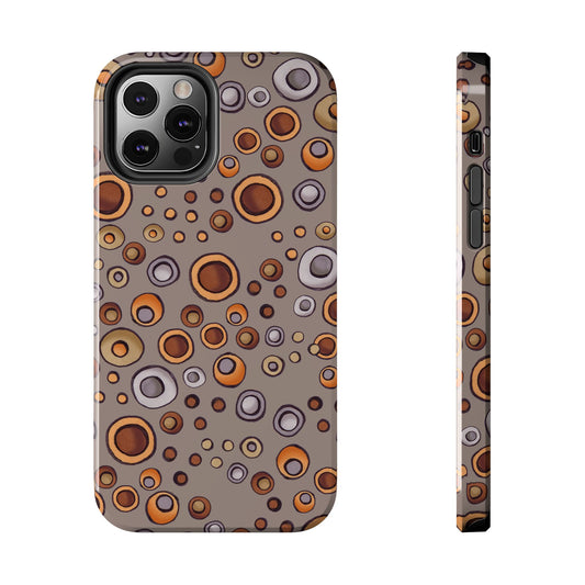 Phone case with a pattern of orange, brown, and gray circles on a taupe background.