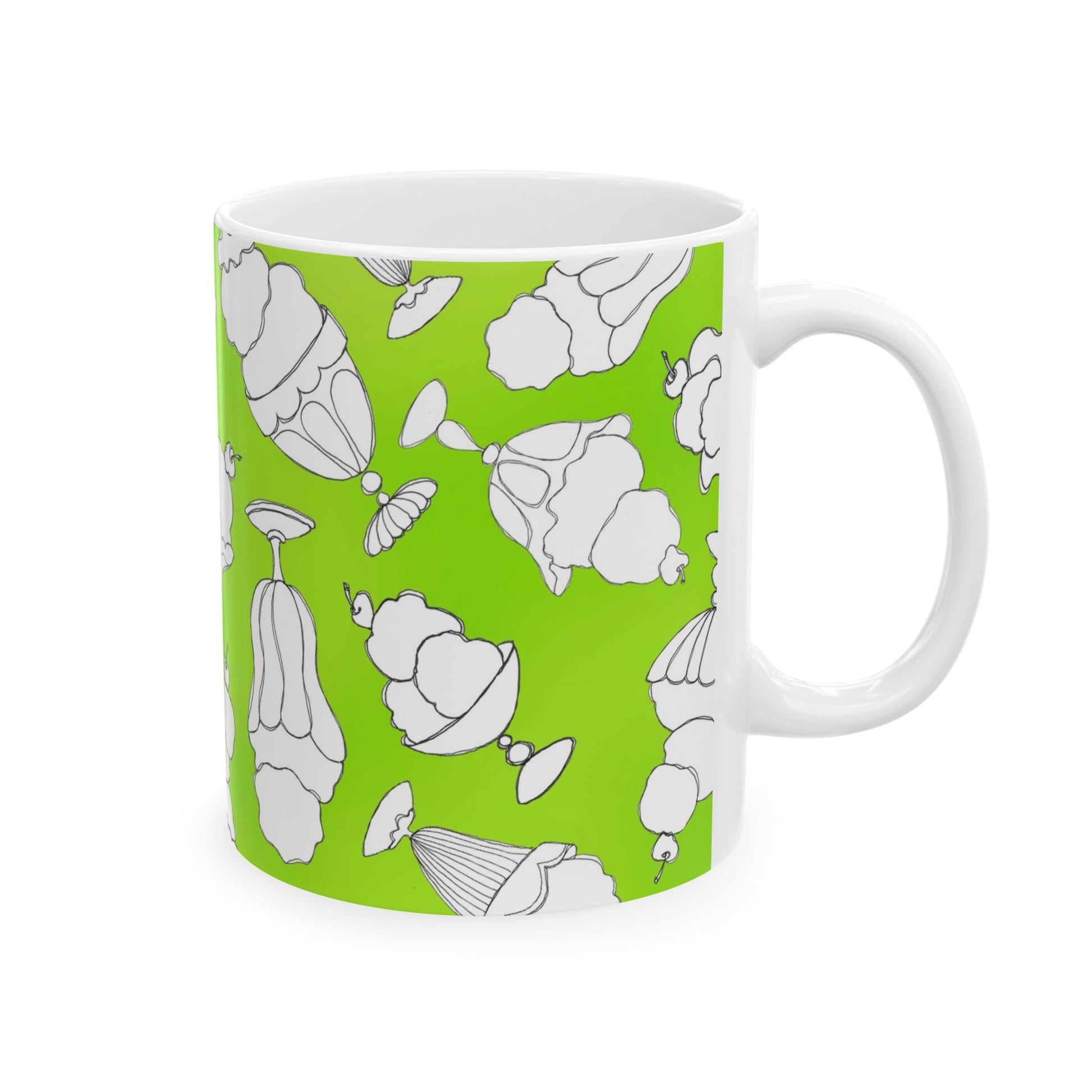 White mug with a bright green background, featuring white dessert illustrations.