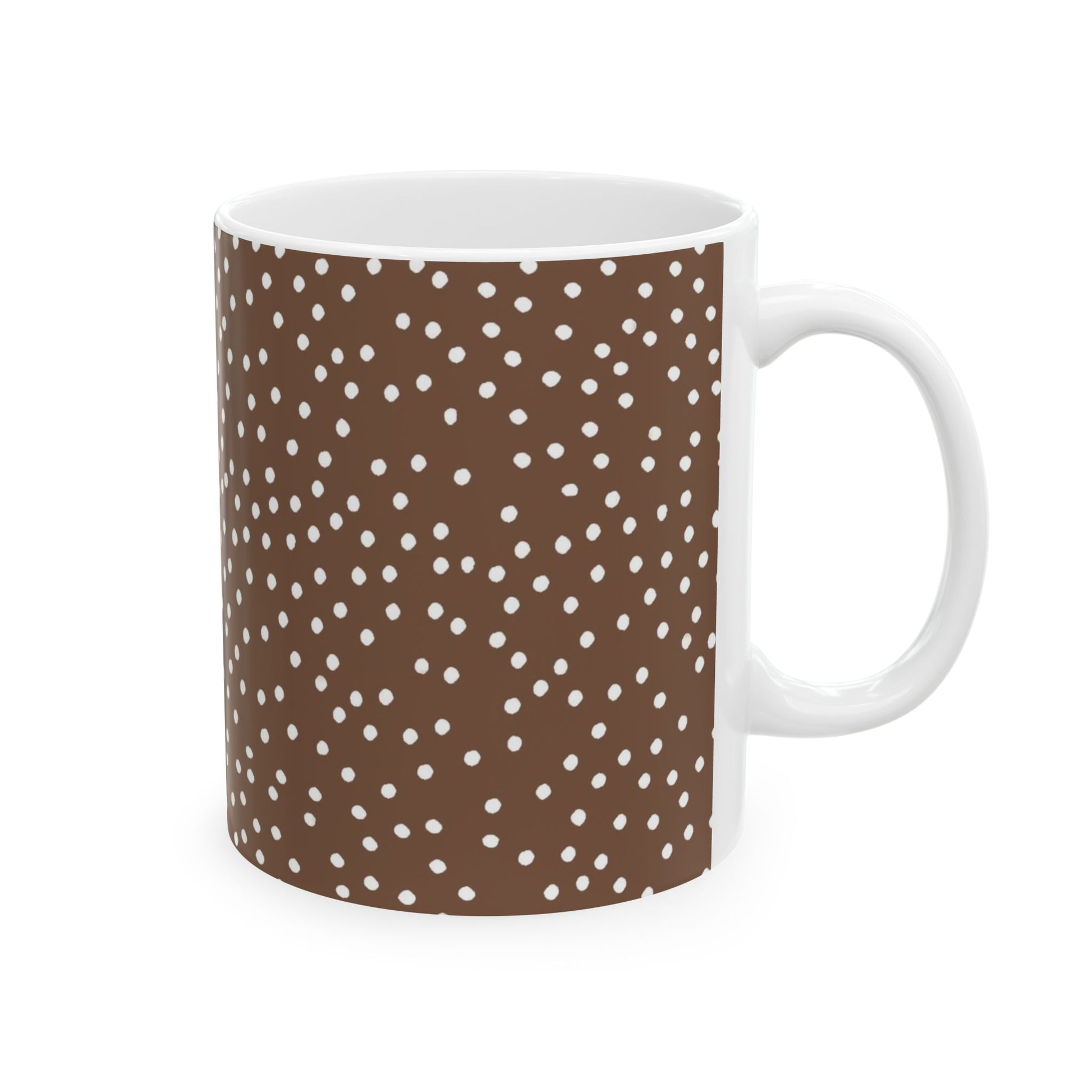 Brown mug with white polka dots and a white handle.