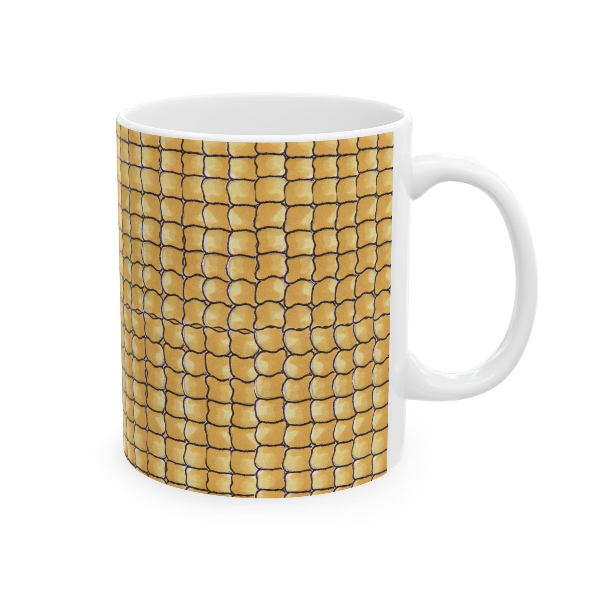 White mug with a yellow corn kernel pattern, featuring black outlines on a smooth surface.