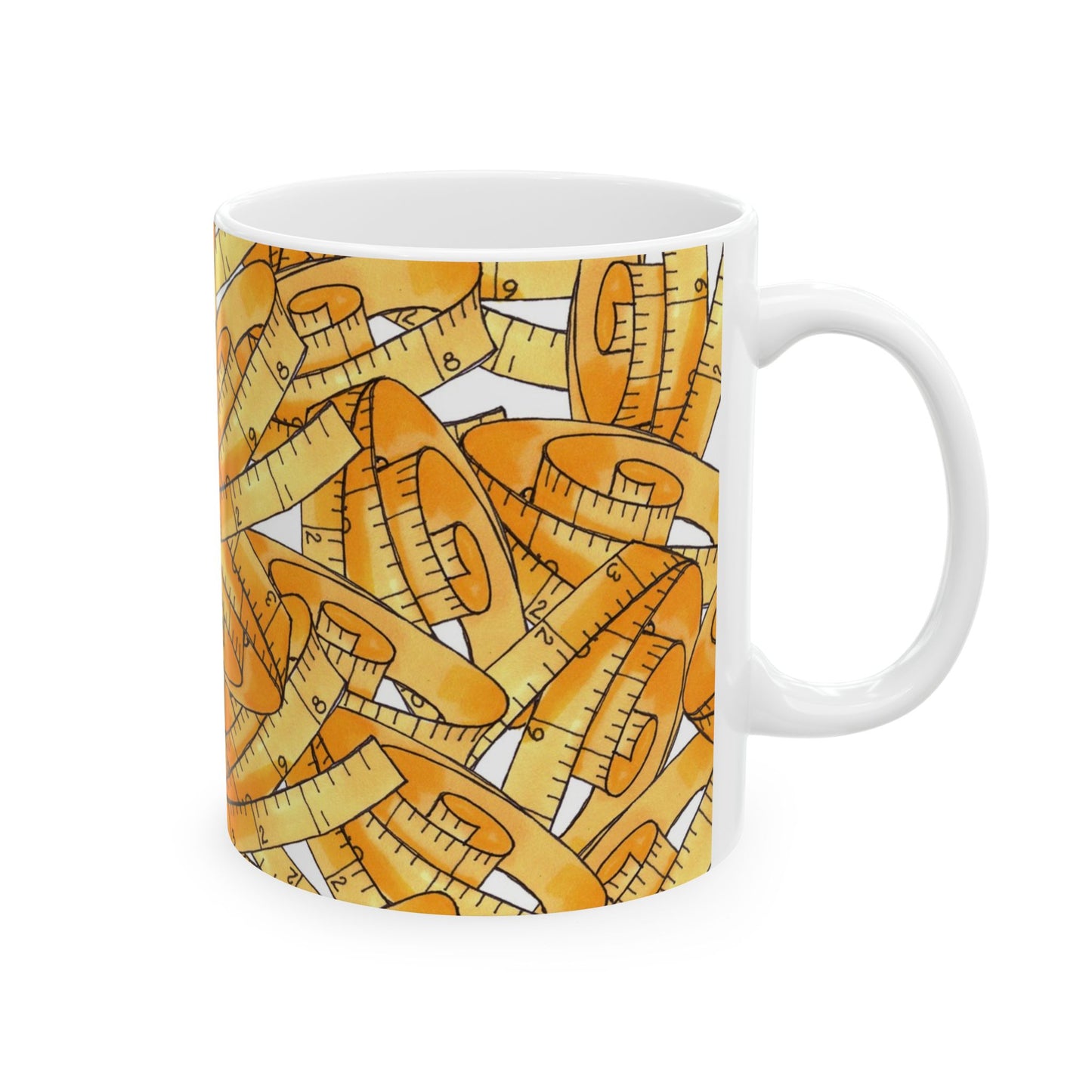 White mug with a pattern of yellow measuring tapes with black markings, against a plain background.